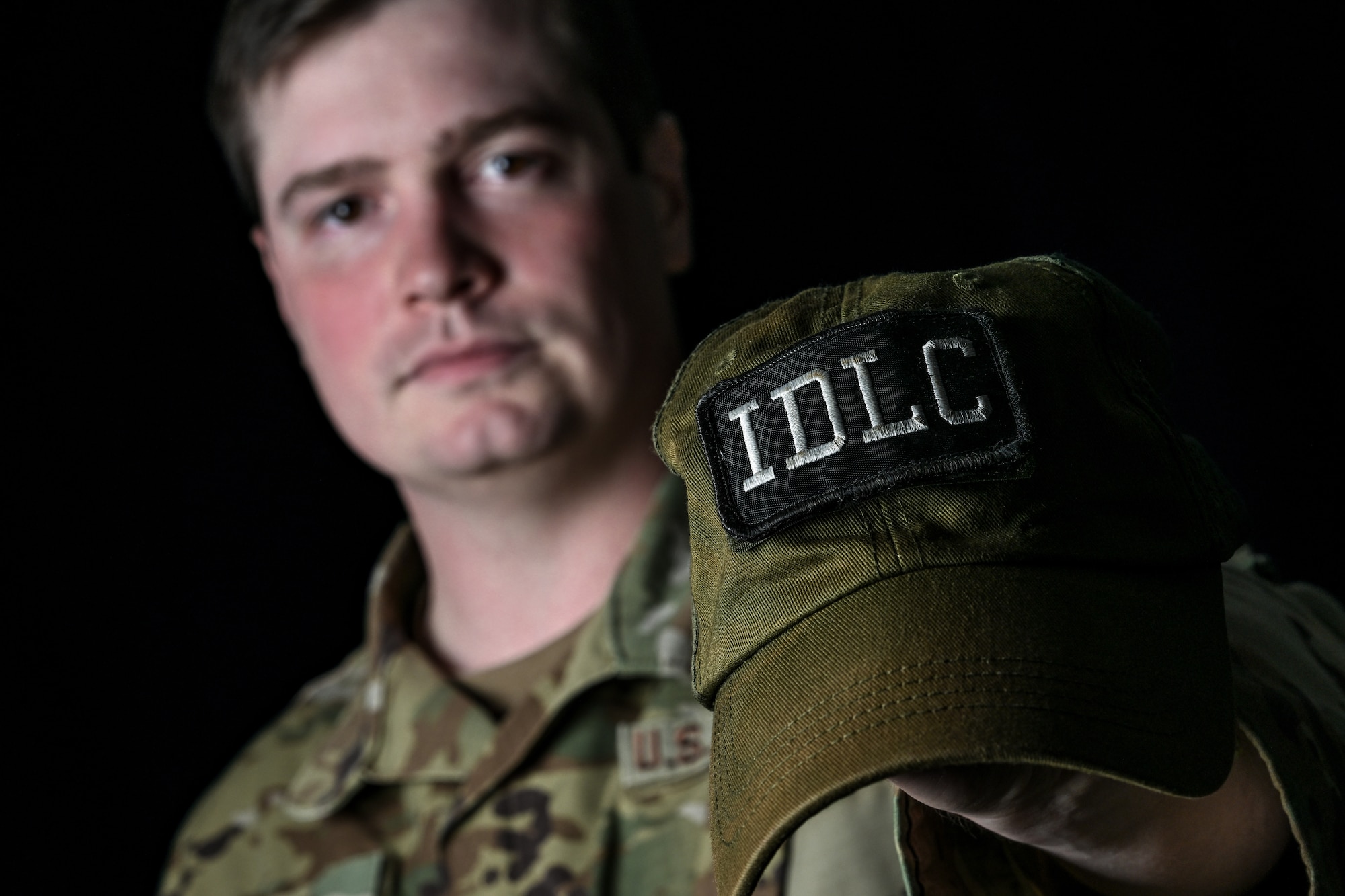 Staff Sgt. Steven Stein, an Integrated Defense Leadership Course cadre member assigned to the 910th Security Forces Squadron at Youngstown Air Reserve Station, Ohio, displays his IDLC hat, Aug. 24, 2023.