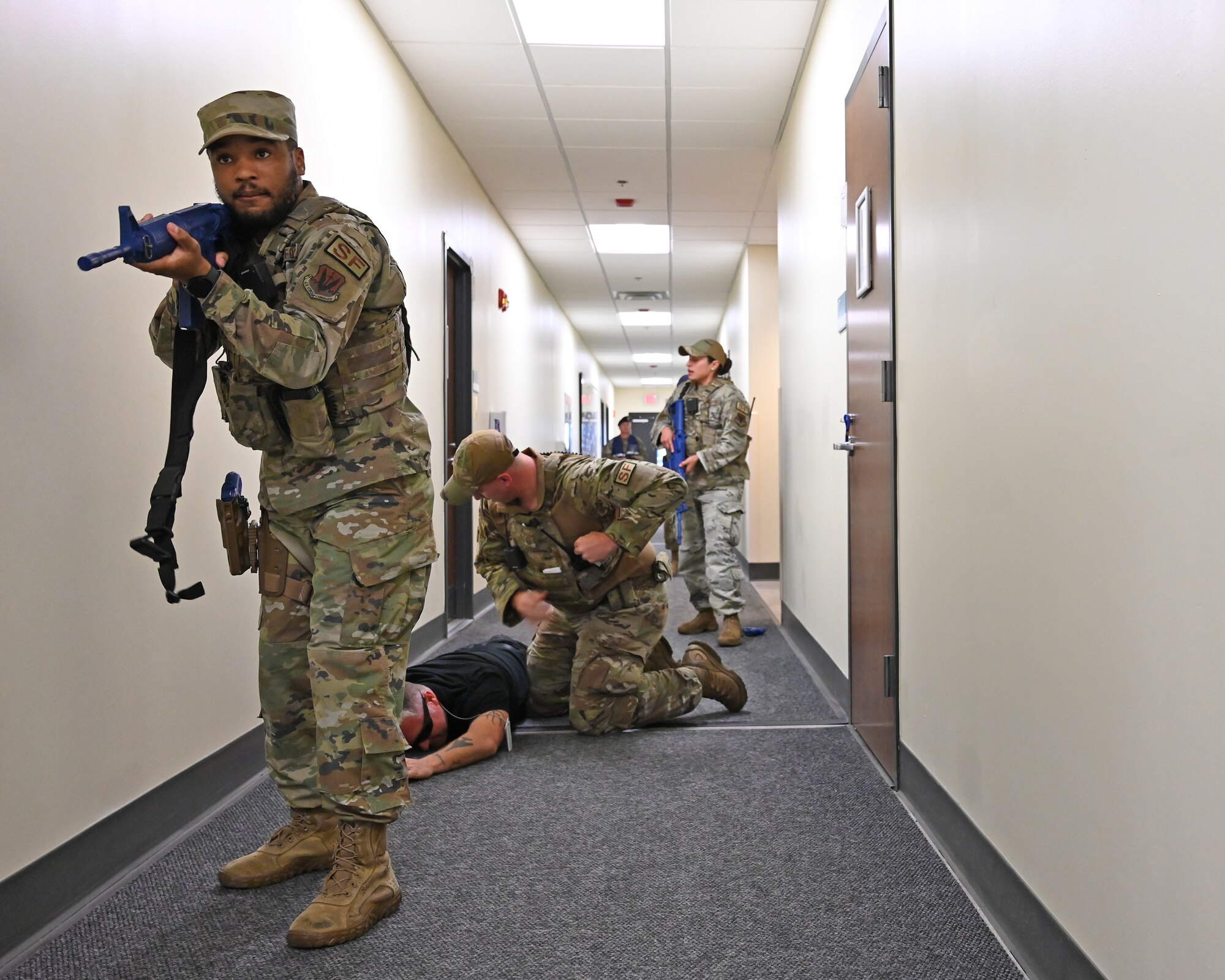 175th Security Forces Airmen apprehend a simulated active shooter during an exercise at Martin State Air National Guard Base, Middle River, Md., Aug. 25, 2023.