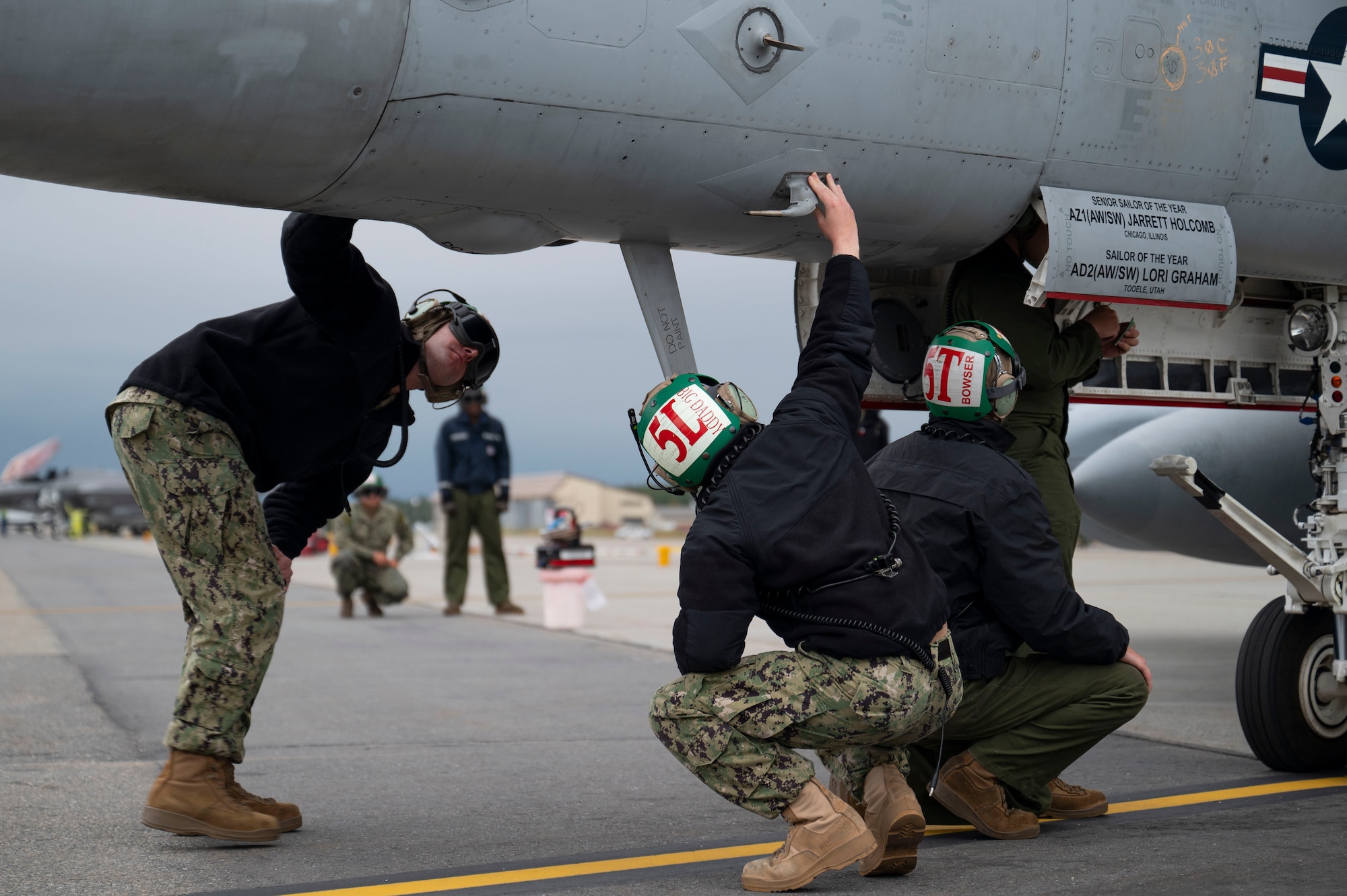 U.S. Navy Sailors assigned to the Electronic Attack Squadron 134 inspect an EA-18G Growler before a mission during Red Flag-Alaska 23-3 at Eielson Air Force Base, Alaska, Aug. 18, 2023. This exercise provides unique opportunities to integrate various forces into joint, coalition and multilateral training from simulated forward operating bases. (U.S. Air Force photo by Senior Airman Megan Estrada)