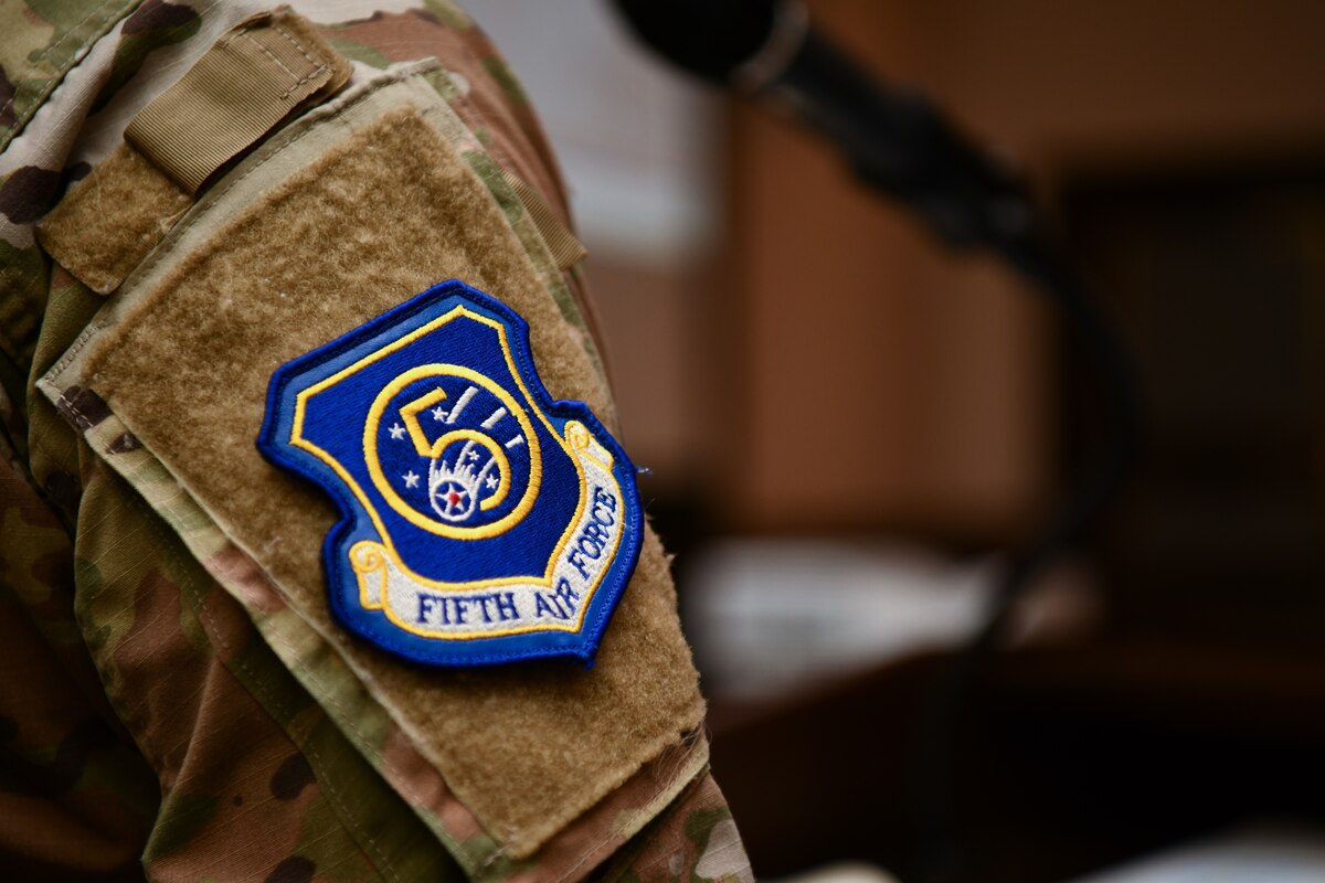 A Fifth Air Force (5th AF) patch rests on the uniform of Maj. Jessica Wong, U.S. Forces Japan chief of space operations and emerging domains, during the 5th AF Commander’s Conference in Tokyo, Japan, Aug. 17, 2023. The purpose of the conference was to focus on the operational responsibilities of 5th AF organizations to meet evolving conditions in the Pacific. (U.S. Air Force photo by Staff Sgt. Spencer Tobler)