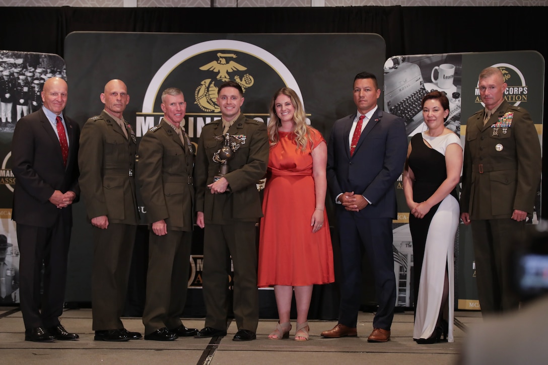U.S. Marine Corps Capt. Brett D. Carlson, an aviation instructor, is honored during an awards ceremony in Arlington, Virginia, Aug. 10, 2023. Carlson, a native of Broomfield, Colorado, was recognized by the Marine Corps as the Formal School Aviation Instructor of the Year for 2022. (U.S. Marine Corps photo by Cpl. Tanner Pittard)