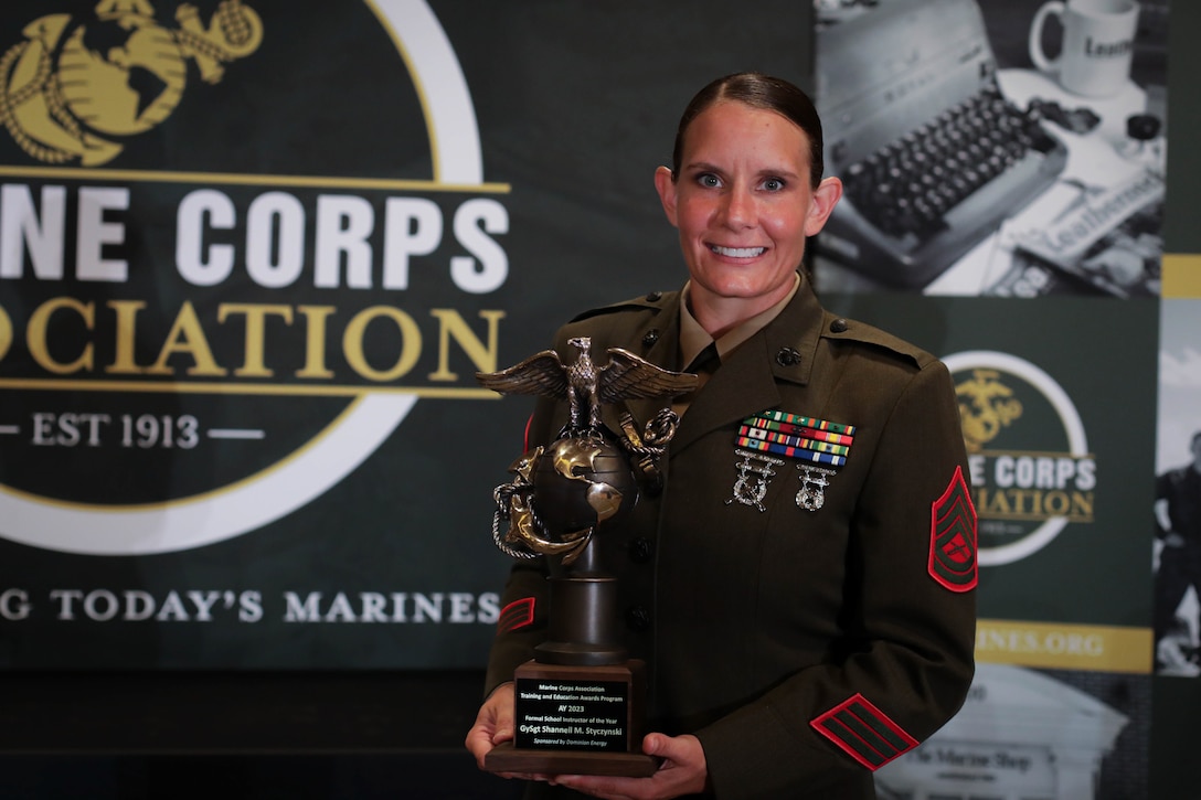 U.S. Marine Corps Gunnery Sgt. Shannell M. Styczynski, a logistics operations instructor, is honored    during an awards ceremony in Arlington, Virginia, Aug. 10, 2023. Styczynski, a native of Green Bay, Wisconsin, was recognized by the Marine Corps as the Formal School Instructor of the Year for 2022. (U.S. Marine Corps photo by Cpl. Tanner Pittard)