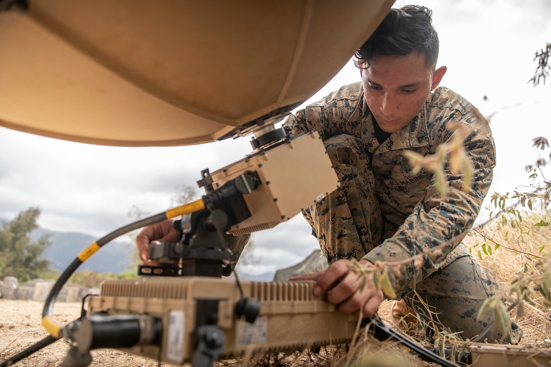 U.S. Marine Corps Lance Cpl. Amado Saltosandrade operates a Marine Corps Wideband Satellite Expeditionary during Pololu Strike at Marine Corps Training Bellows, Hawaii, August 22, 2023. Pololu Strike is a 3d MLR exercise consisting of staff education, planning, and battalion-led field training. The training focuses on the education and development of 3d MLR and battalion staffs, deliberate planning repetitions, and execution of training and readiness standards in a field environment. Saltosandrade is a satellite communications operator with 3d Littoral Combat Team, 3d Marine Littoral Regiment, 3d Marine Division and is a native of Coral Springs, Calif.