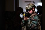 Airman 1st Class Aislinn Molina, 8th Security Forces Squadron installation entry controller, aims her  M4 Carbine Rifle while keeping watch during an opposition force training event with the 8th Communications Squadron during Beverly Pack 23-2 at Kunsan Air Base, Republic of Korea, Aug. 22, 2023. The 8th SFS personnel were evaluated on their use of Tactical Combat Casualty Care, cover and team movements from room to room.   (U.S. Air Force photo by Senior Airman Karla Parra)
