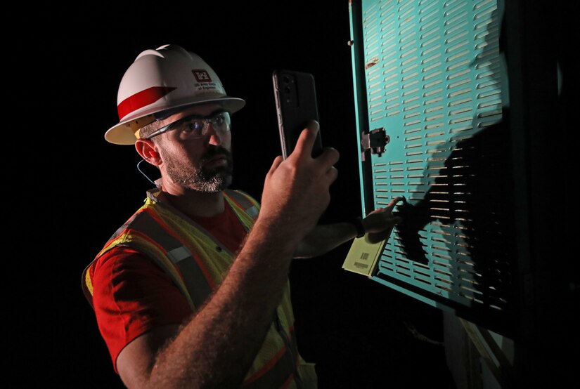 on Runnels, quality assurance representatives deployed with the U.S. Army Corps of Engineers Temporary Emergency Power Team, perform a quality assurance inspection of a generator at a water pump station on Maui, Aug 22.
