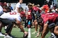 Football players line up on a football field.