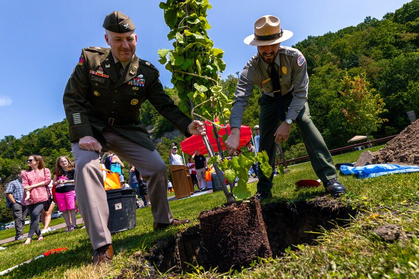 Pittsburgh District Commander Nicholas Melin and Supervisory Natural Resource Specialist Vince Klinkner plant a tree during a dedication ceremony at Youghiogheny River Lake’s 75th celebration in Confluence, Pennsylvania Aug. 19, 2023.