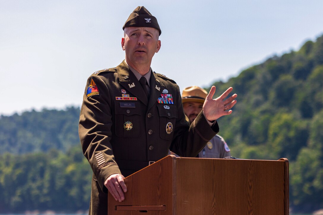 Pittsburgh District Commander Nicholas Melin reflects on the history, mission and Youghiogheny River Lake's future of during the time capsule dedication ceremony at the facility’s 75th celebration in Confluence, Pennsylvania Aug. 19, 2023. Lake staff dedicated two time capsules were dedicated during the ceremony. One capsule held public messages, and another was for facility staff to include keepsakes such as a maintenance uniform shirt, a staff photo, name pins, and notes to future counterparts. Future lake staff will open the time capsules at the lake’s centennial celebration in 2048.