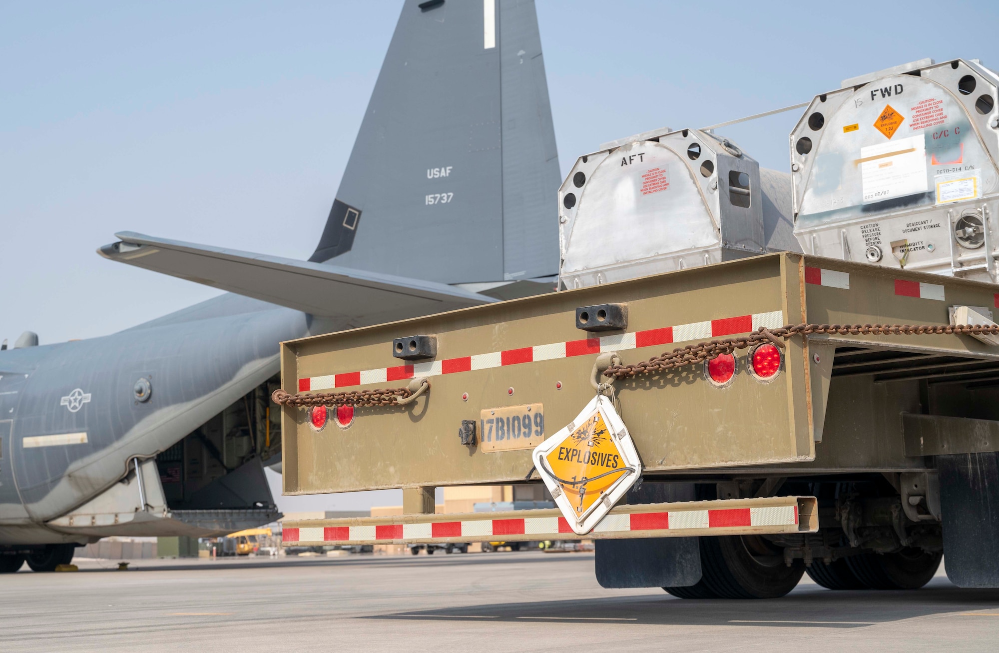 Members of the U.S. Air Force 6th Expeditionary Maintenance Squadron and the 6th Special Operations Tasking Unit stage Joint Air-to-Surface Standoff Missiles (JASSM) next to an MC-130J Commando II at Al Udeid Air Base, Qatar, Aug. 6, 2023. The Rapid Dragon palletized munitions system is capable of deploying long-range cruise missiles using standard airdrop procedures from cargo aircraft like the MC-130J operated by Air Force Special Operations Command. Rapid Dragon is a precision munitions capability for medium-sized or larger cargo aircraft that allows U.S. forces a flexible rapid response option. (U.S. Air Force photo by Staff Sgt. Frank Rohrig)