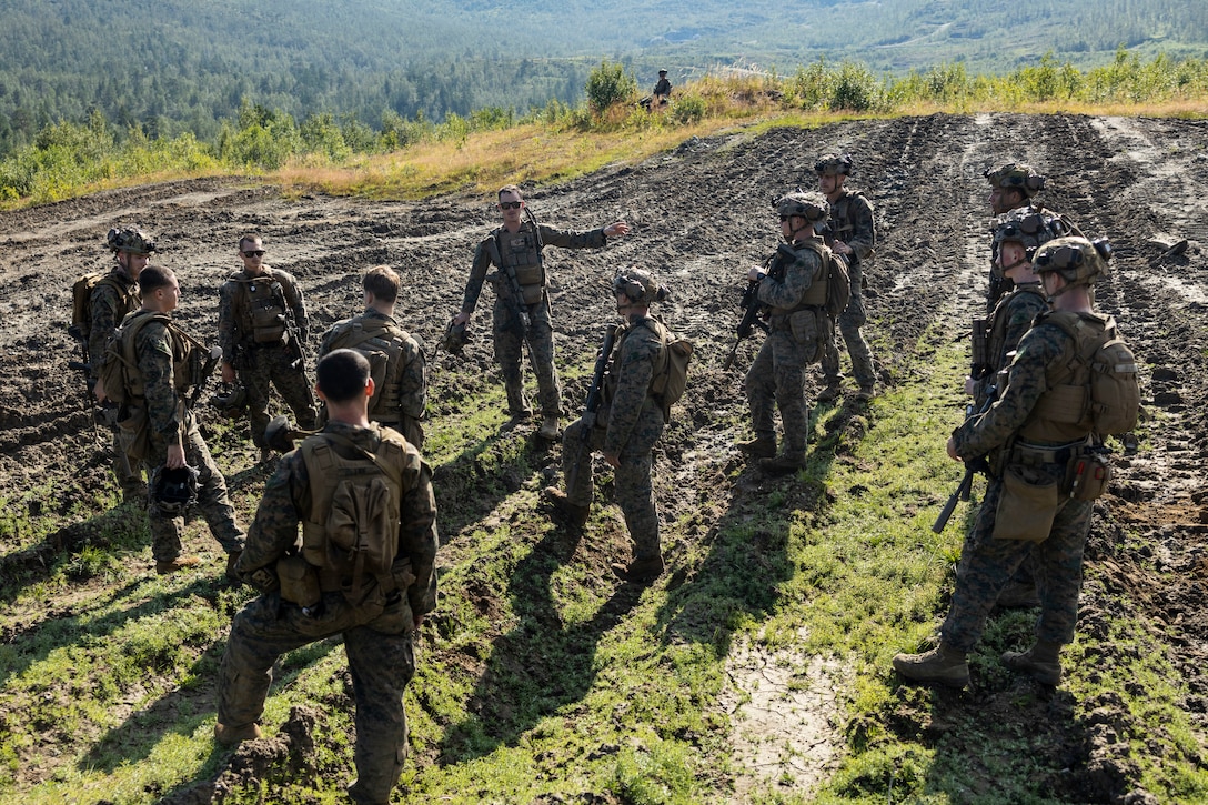 U.S. Marines with the Battalion Landing Team 1/6, 26th Marine Expeditionary Unit (Special Operations Capable) (MEU(SOC)) Bravo Command Element, go over patrol tactics before executing small unit leader training, while participating in a Norwegian Bilateral Exercise in Setermoen, Norway, Aug. 8, 2023. The San Antonio-class amphibious transport dock ship USS Mesa Verde (LPD 19), assigned to the Bataan Amphibious Ready Group and embarked 26th MEU(SOC), under the command and control of Task Force 61/2, is on a scheduled deployment in the U.S. Naval Forces Europe area of operations, employed by U.S. Sixth Fleet to defend U.S., allied and partner interests. (U.S. Marine Corps photo by Staff Sgt. Jesus Sepulveda Torres