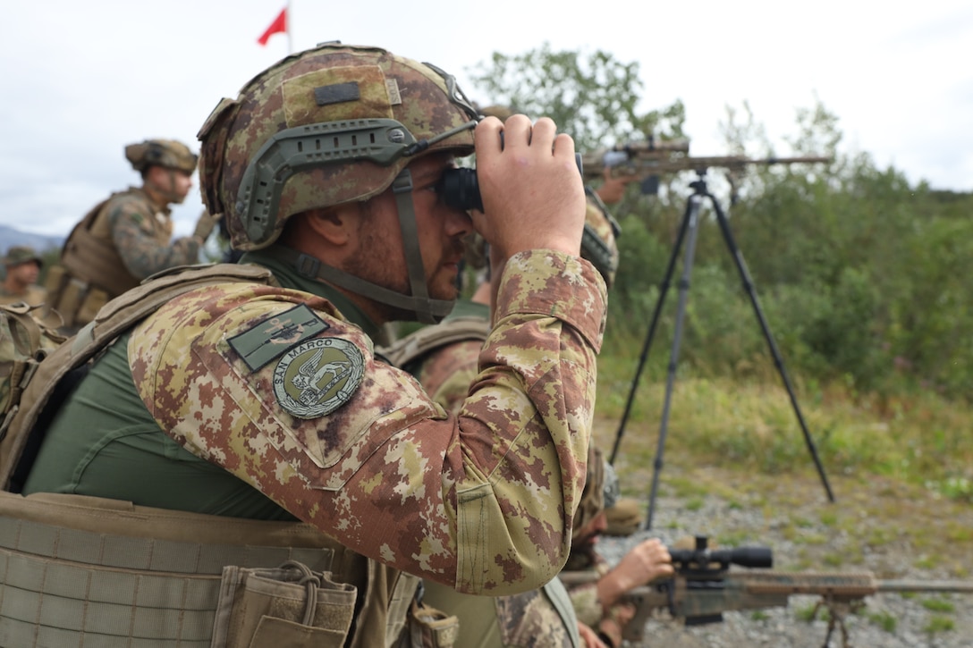 U.S. Marines with the Battalion Landing Team 1/6, 26th Marine Expeditionary Unit (Special Operations Capable) (MEU(SOC)) Bravo Command Element engage targets while training with Italian Marines San Marco Brigade, during an integrated live-fire sniper range part of a Norwegian Bilateral Exercise in Setermoen, Norway, Aug. 12, 2023. The San Antonio-class amphibious transport dock ship USS Mesa Verde (LPD 19), assigned to the Bataan Amphibious Ready Group and embarked 26th MEU(SOC), under the command and control of Task Force 61/2, is on a scheduled deployment in the U.S. Naval Forces Europe area of operations, employed by U.S. Sixth Fleet to defend U.S., allied and partner interests. (U.S. Marine Corps photo by Staff Sgt. Jesus Sepulveda Torres