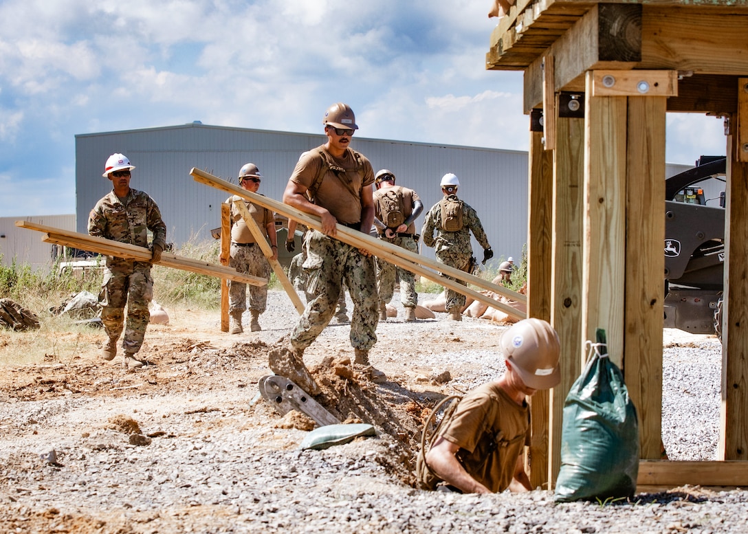 U.S. Navy Seabees assigned to Naval Mobile Construction Battalion (NMCB) 11 construct a hardened sentry post during an expeditionary construction exercise in the Port of Gulfport, Miss., August 9, 2023.