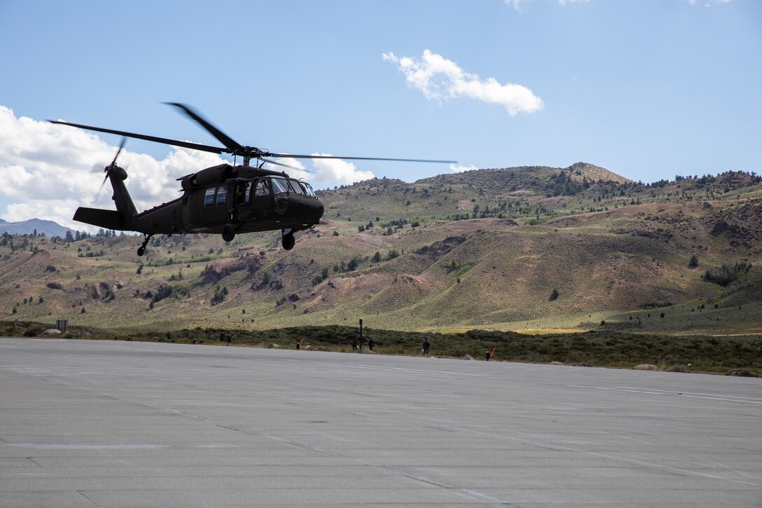 A U.S. Army UH-60 Black with the Marietta-based Alpha Company, 1st Battalion, 171st General Support Aviation Regiment, 78th Aviation Troop Command, Georgia Army National Guard, takes off at the Marine Corps Mountain Warfare Training Center, Bridgeport, California, Aug. 25, 2023. Tough and realistic training in remote locations ensures the Georgia Army National Guard provides ready and relevant forces to our active-duty partners both in the state of Georgia, the United States, and across the globe. U.S. Army National Guard photo by Sgt. 1st Class Lannom Jr.