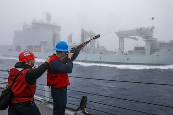 USS Benfold (DDG 65) replenishes from MV Asterix in the north Pacific Ocean.