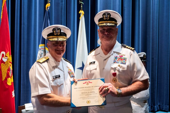 Washington, D.C. (August 25, 2023) -- Rear Admiral Darin Via, Acting Surgeon General, awards Capt. Douglas Stephens the Legion of Merit. On August 25, 2023, Stephens, a 39-year veteran and Bureau of Medicine and Surgery (BUMED) Chief of Staff, was piped ashore in a ceremony held at the Naval Memorial in Washington, D.C. (U.S. Navy photo by Mass Communication Specialist 1st Class John Grandin)