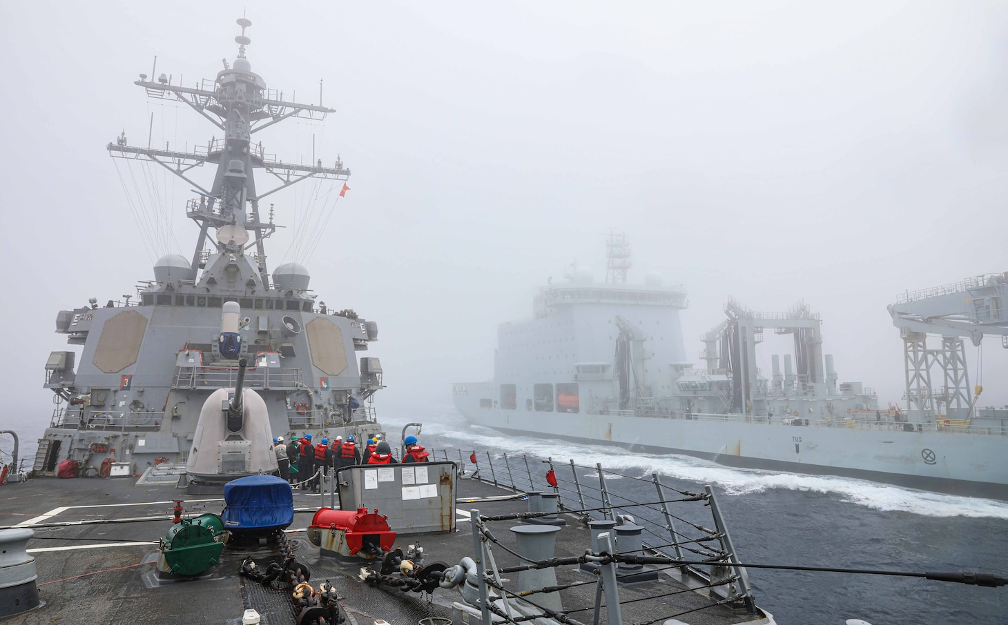 The Arleigh Burke-class guided-missile destroyer USS Benfold (DDG 65) and the Royal Canadian Navy replenishment ship MV Asterix conduct a replenishment-at-sea in the North Pacific Ocean on Aug. 25.