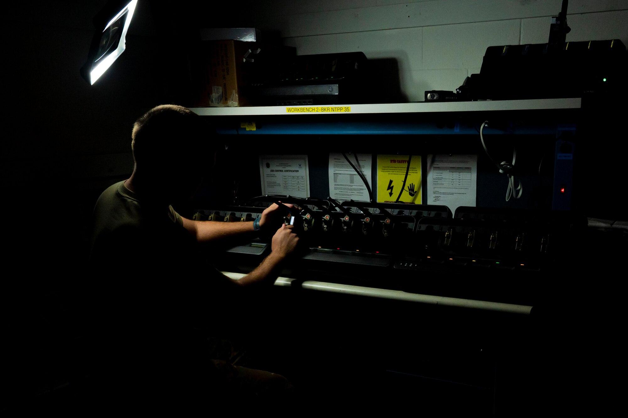 Service member adjusts radios