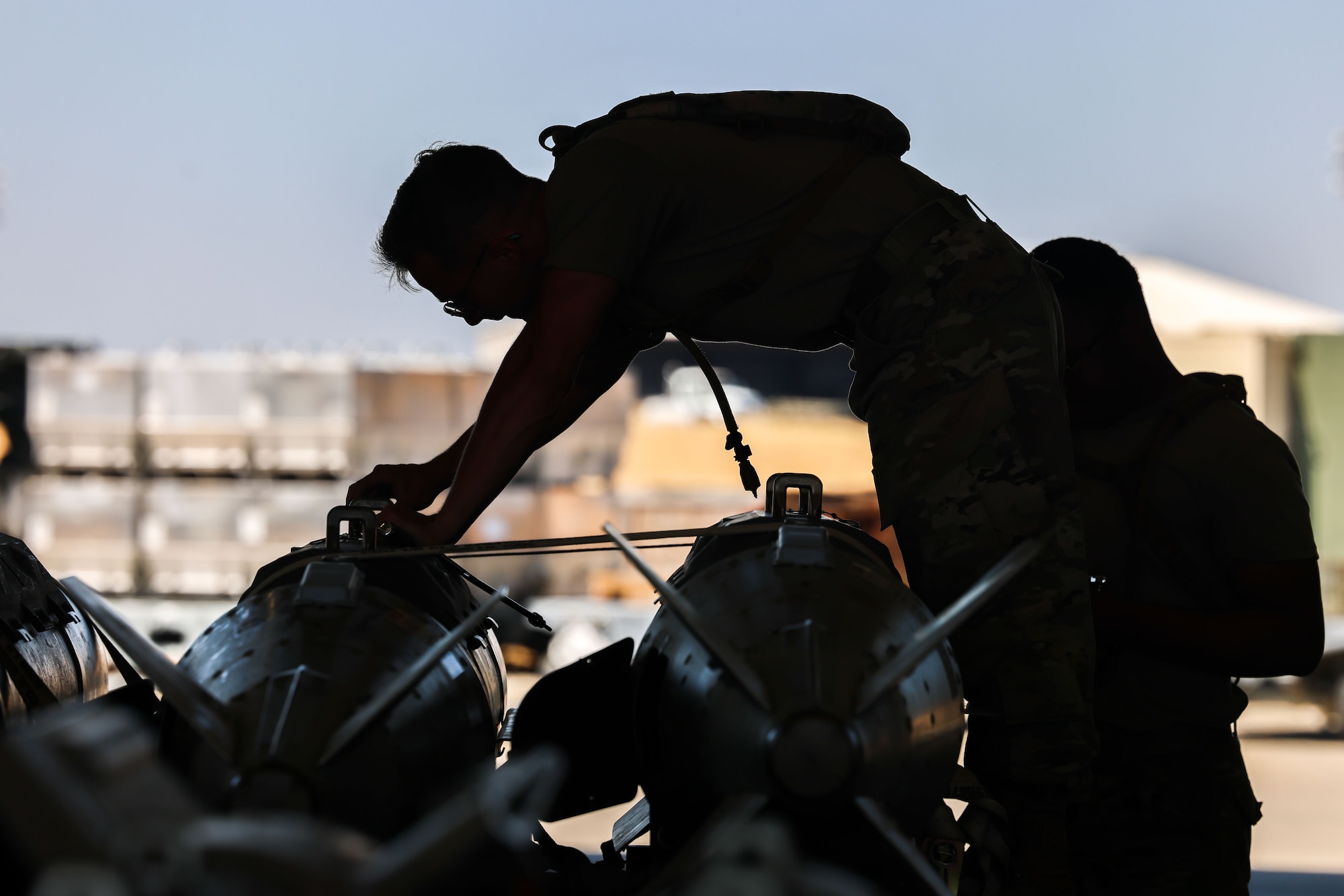 U.S. Air Force Senior Airman Jacob Horning, 96th Maintenance Squadron precision guided munitions crew chief from Eglin Air Force Base, Florida, inspects a bomb during the Air Force Combat Operations Competition (AFCOCOMP) on Beale AFB, Aug. 24, 2023.