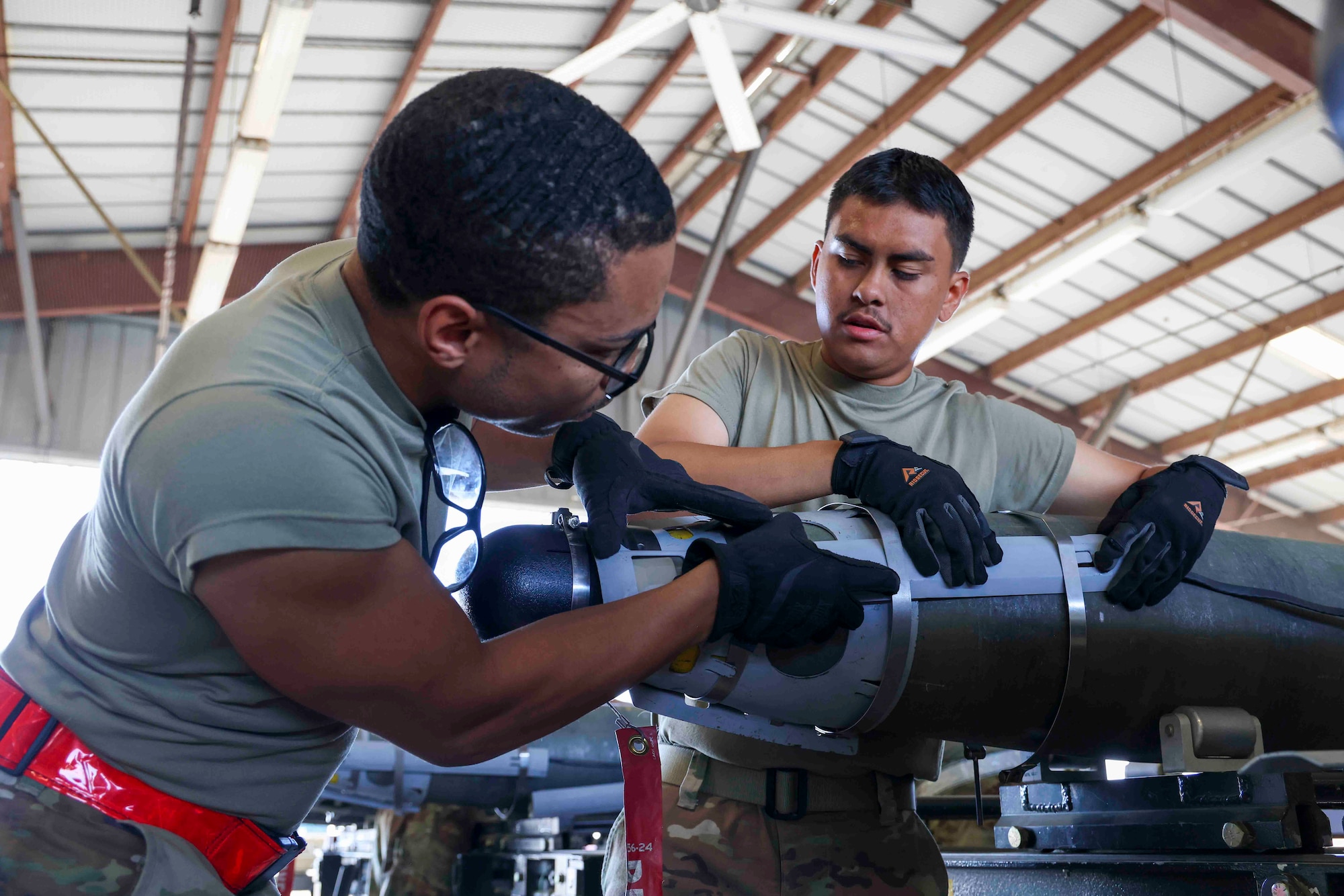 U.S. Air Force Airmen from Whiteman Air Force Base, Missouri, 509th Munitions Squadron, build GBU-54 munitions as part of an event during the Air Force Combat Operations Competition, Aug. 23, 2023, at Beale AFB, California.