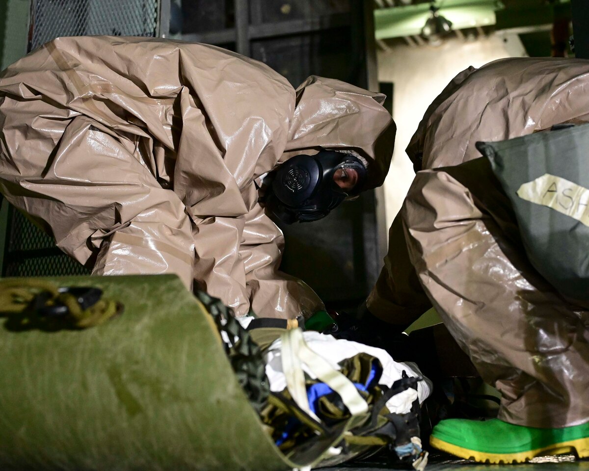 U.S. Air Force Airman Lydia Schubert, left, and Senior Airman Jessica Ashwell, right, 355th Civil Engineer Squadron emergency management technicians, perform decontamination and cut-out procedures for rescue victims during a training exercise at the Titan Missile Museum in Green Valley, Ariz., Aug. 22, 2023. Simulated victims from a contaminated location were decontaminated before they were medically evacuated. (U.S. Air Force photo by Staff Sgt. Nicholas Ross)