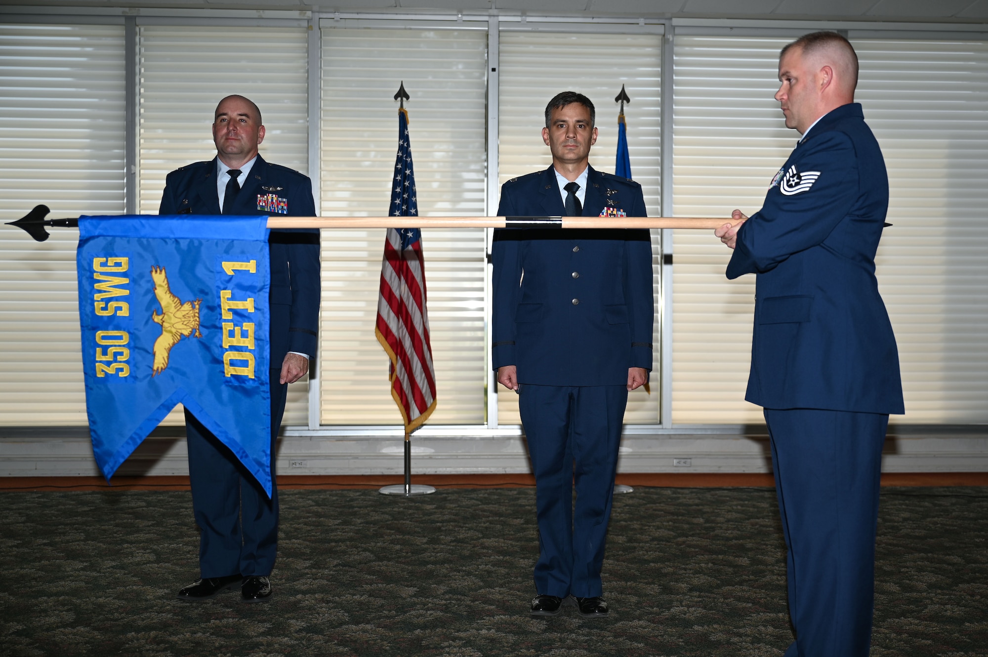 U.S. Air Force Col. Robert Cocke, 350th Spectrum Warfare Group commander, left, passes the guidon to U.S. Air Force Lt. Col. Luke Marron, 350th Spectrum Warfare Group, Detachment 1 assuming commander, right, at Eglin Air Force Base, Aug. 25, 2023. The 350th SWG, Det 1 will enhance the Combat Air Force’s survivability in the electromagnetic spectrum while accomplishing function and theater-specific Combatant Commander assigned missions.
(U.S. Air Force photo by Staff Sgt. Ericka A. Woolever)