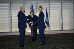 Airmen present the guidon of the new 350th Spectrum Warfare Group Detachment 1 during an activation ceremony at Eglin Air Force Base, Fla., Aug. 25, 2023. The 350th SWG, Det 1’s mission is to enhance the survivability in the Electromagnetic Spectrum while accomplishing function and theater-specific combatant commander assigned missions. (U.S. Air Force photo by Capt. Benjamin Aronson)