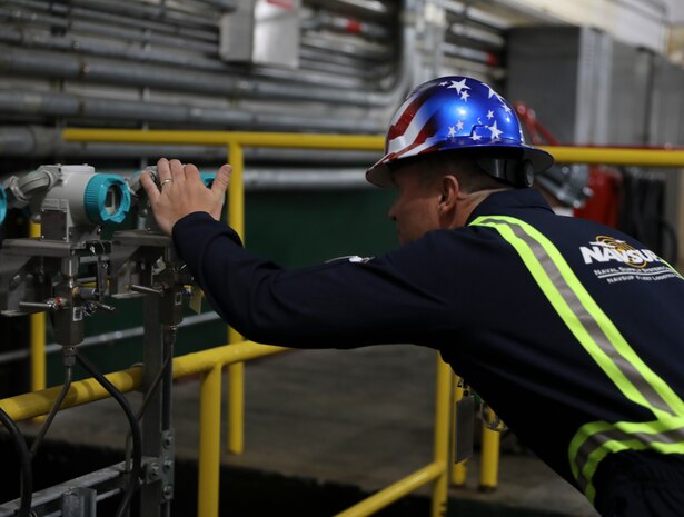 As Joint Task Force-Red Hill (JTF-RH) repacking operations commence in the Red Hill Bulk Fuel Storage Facility (RHBFSF), Fleet Logistics Center Pearl Harbor Fuels Director, Cmdr. Joseph Bossi, inspects gauges as fuel reenters the pipeline, Joint Base Pearl Harbor-Hickam, Honolulu, Hawaii, Aug. 28, 2023. Repacking is necessary to remove all air from the pipelines and ensure a stable flow of fuel when defueling the main underground storage tanks. JTF-RH is in phase three of its five-phase defueling plan. Personnel are focused on completing quality control tasks, training, response preparation, the National Environmental Policy Act Environmental Assessment, regulatory approvals and operational planning for all future major milestones. This extensive preparatory work will help ensure the safe and expeditious defueling of the RHBFSF. (DoD photo by U.S. Army Staff Sgt. Randall Corpuz)