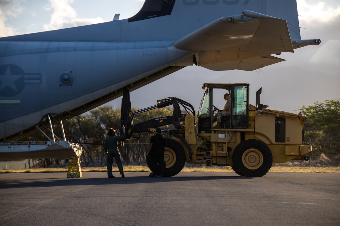 U.S. Marines with Marine Aerial Refueler Transport Squadron 153 (VMGR-153), Marine Aircraft Group 24, 1st Marine Aircraft Wing, prepare to unload equipment from a KC-130J Hercules at Kahului Airport, Maui, Hawaii, Aug. 22, 2023. At the request of Joint Task Force 50, and in accordance with U.S. federal law, Hawaii based U.S. Marines with VMGR-153 provided inter-island transportation of personnel and equipment from Oahu to Maui. (U.S. Marine Corps photo by Lance Cpl. Logan Beeney)