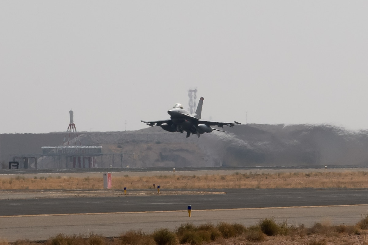 An F-16 Fighting Falcon assigned to the 125th Expeditionary Fighter Squadron takes flight during Operation Agile Spartan 23.2, Kingdom of Saudi Arabia, Aug. 20, 2023. Agile Spartan 23.2 is a multinational operation aimed at strengthening interoperability, improving response capabilities, and furthering security cooperation initiatives throughout the U.S. Central Command area of responsibility. The exercise provides a chance for U.S. forces and  its regional partners to validate and expand the number of Agile Combat Employment (ACE) locations from which coalition air forces can generate combat missions. (U.S. Air Force photo by Tech. Sgt. Alexander Frank)