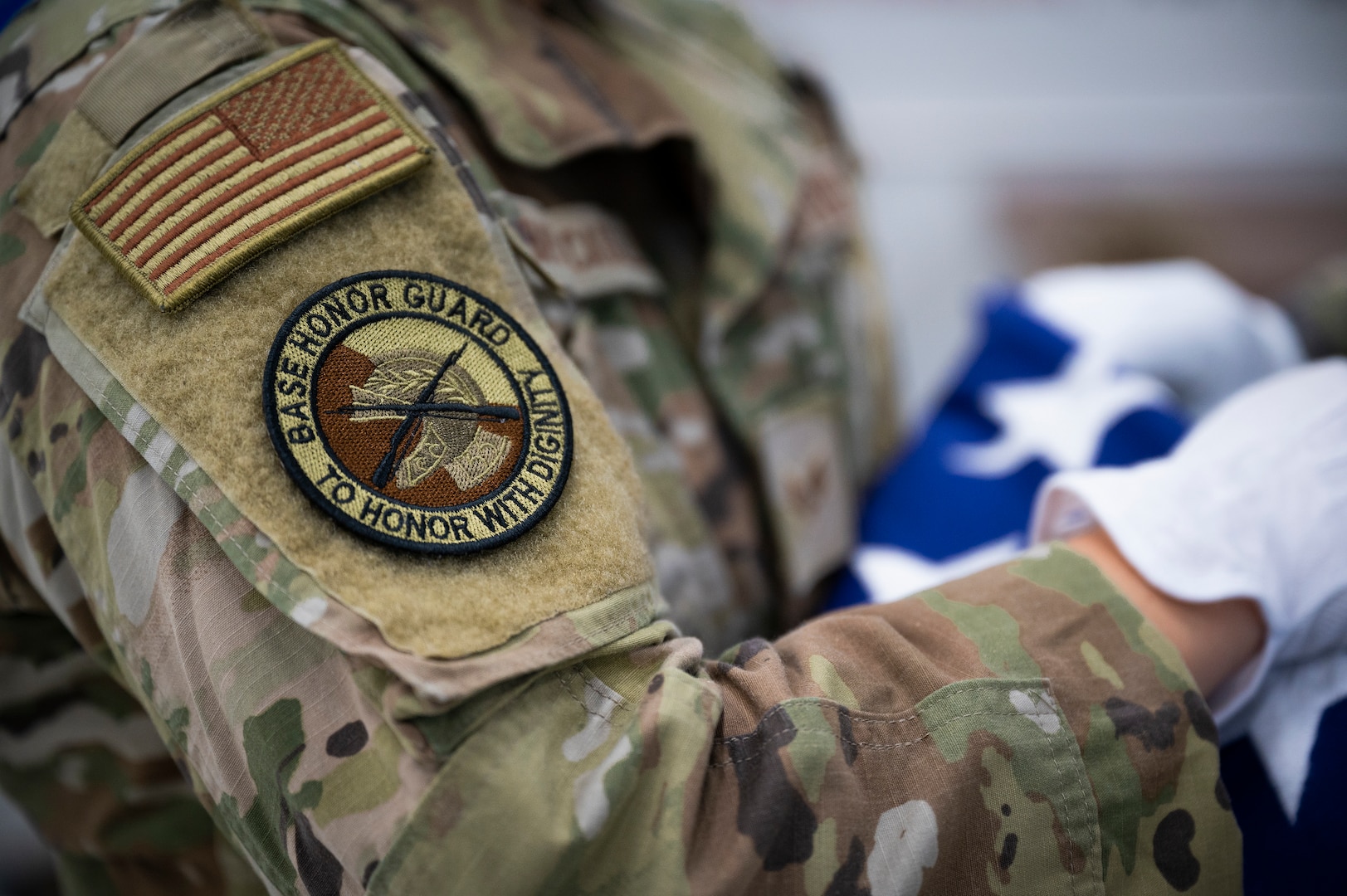 A morale patch is worn on a uniformed personnel's right arm.