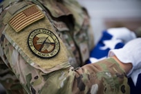 A morale patch is worn on a uniformed personnel's right arm.