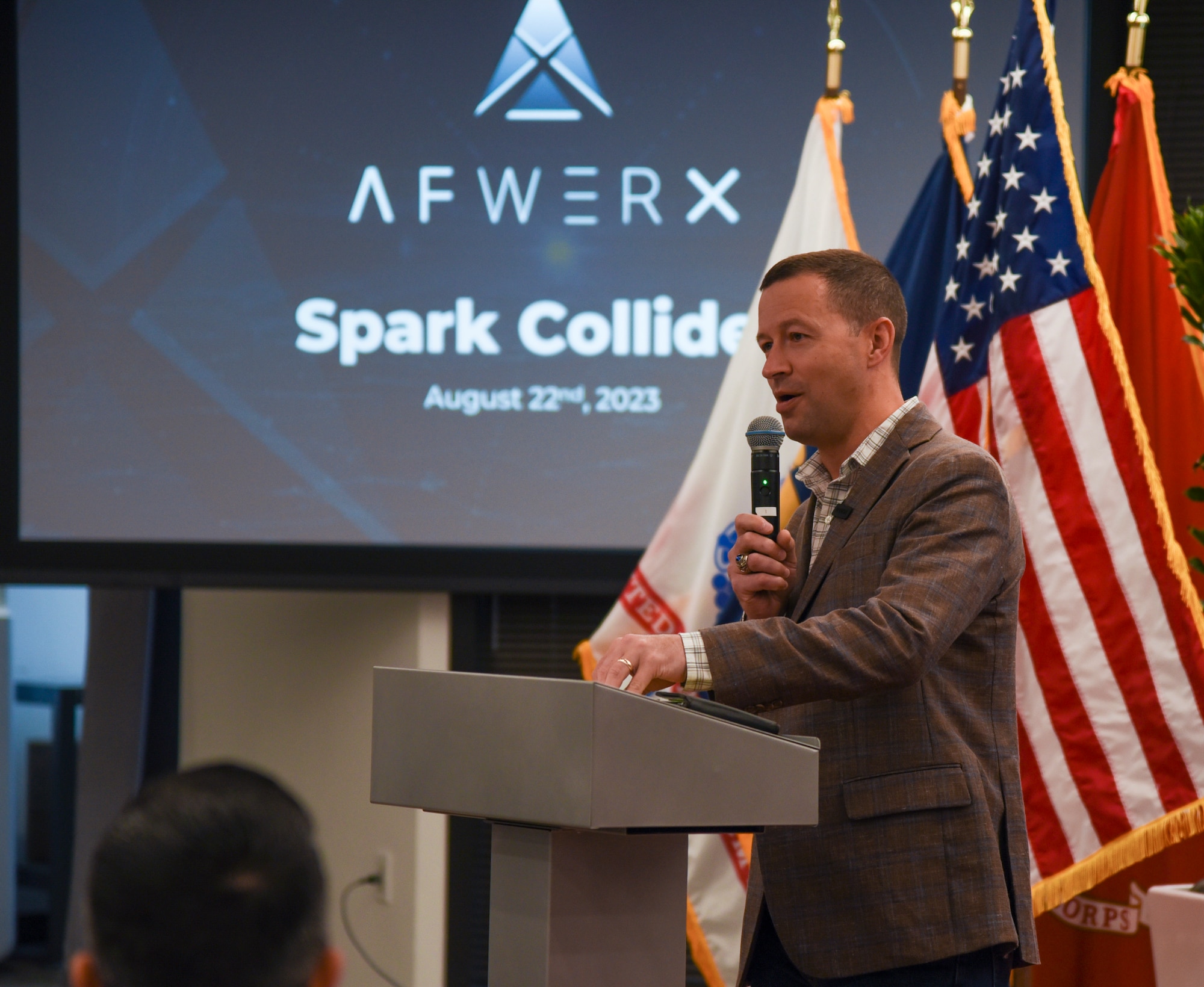 Col. Elliott Leigh, AFWERX director and chief commercialization officer for the Department of the Air Force, kicks off the Fed Supernova Spark Collider event with a briefing to attendees at Capital Factory in Austin, Texas, Aug. 22, 2023.