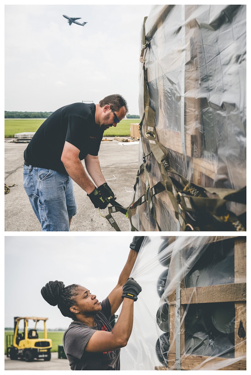 Contractors with LRS plastic-wrap a pallet of cargo.