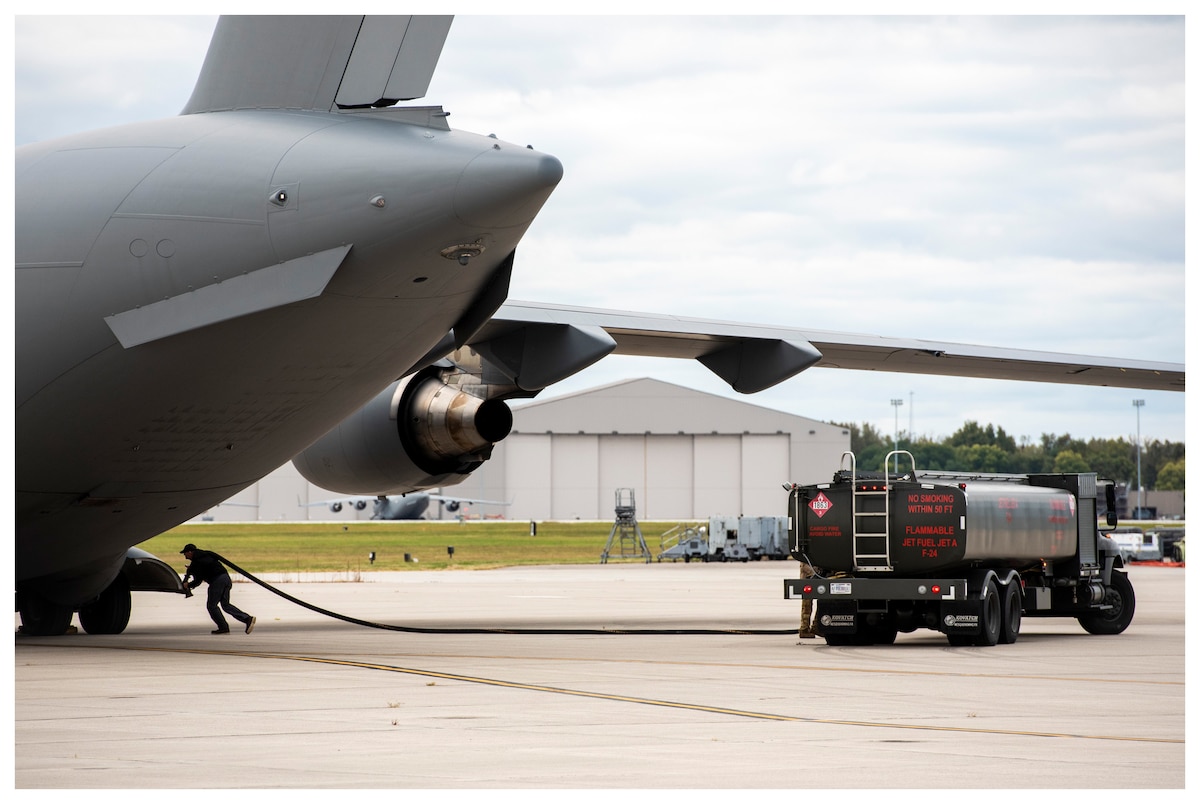 A LRS contractor provides fuel to an aircraft.