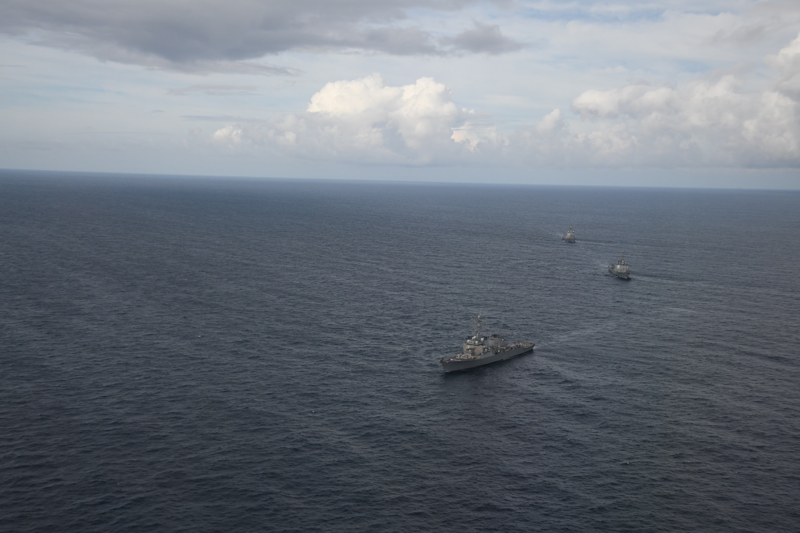 Japanese Maritime Self-Defense Force Maya-class guided missile destroyer Haguro (DDG-180); Arleigh Burke-class guided-missile destroyer USS Benfold (DDG 65); and Republic of Korea Sejong the Great-class destroyer Yulgok Yi (DDG-992) sail in formation during a trilateral exercise on Aug. 29.