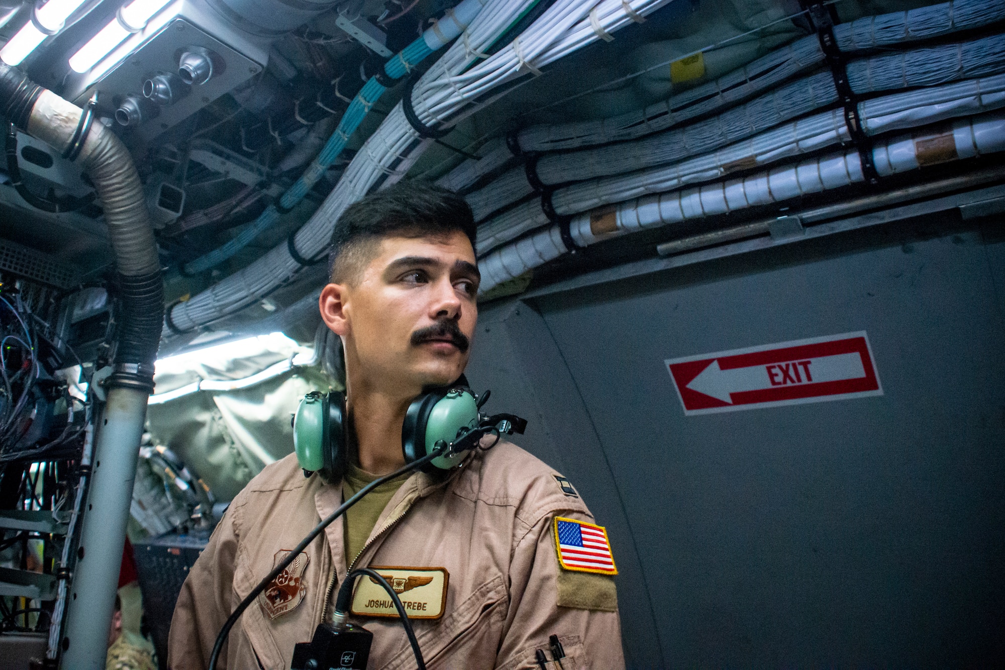 Service member standing inside an aircraft