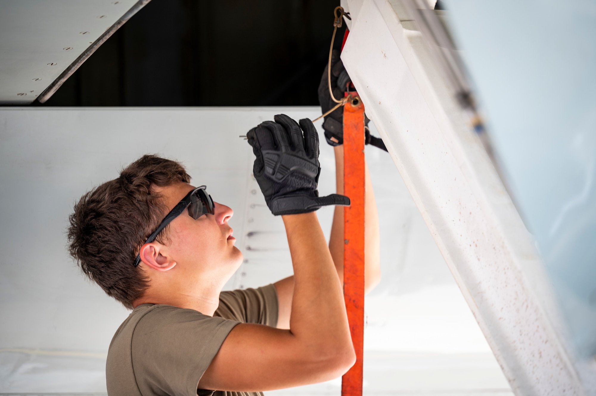 Service member working on an aircraft outside