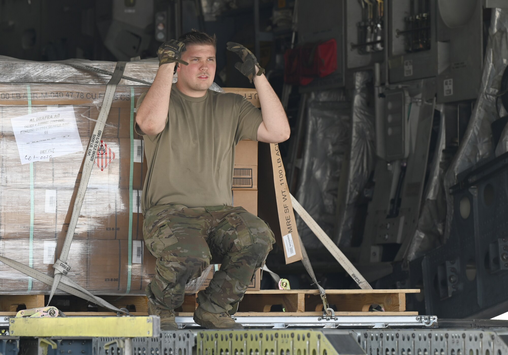 A photo of an Airman in the cargo bay of an aircraft.