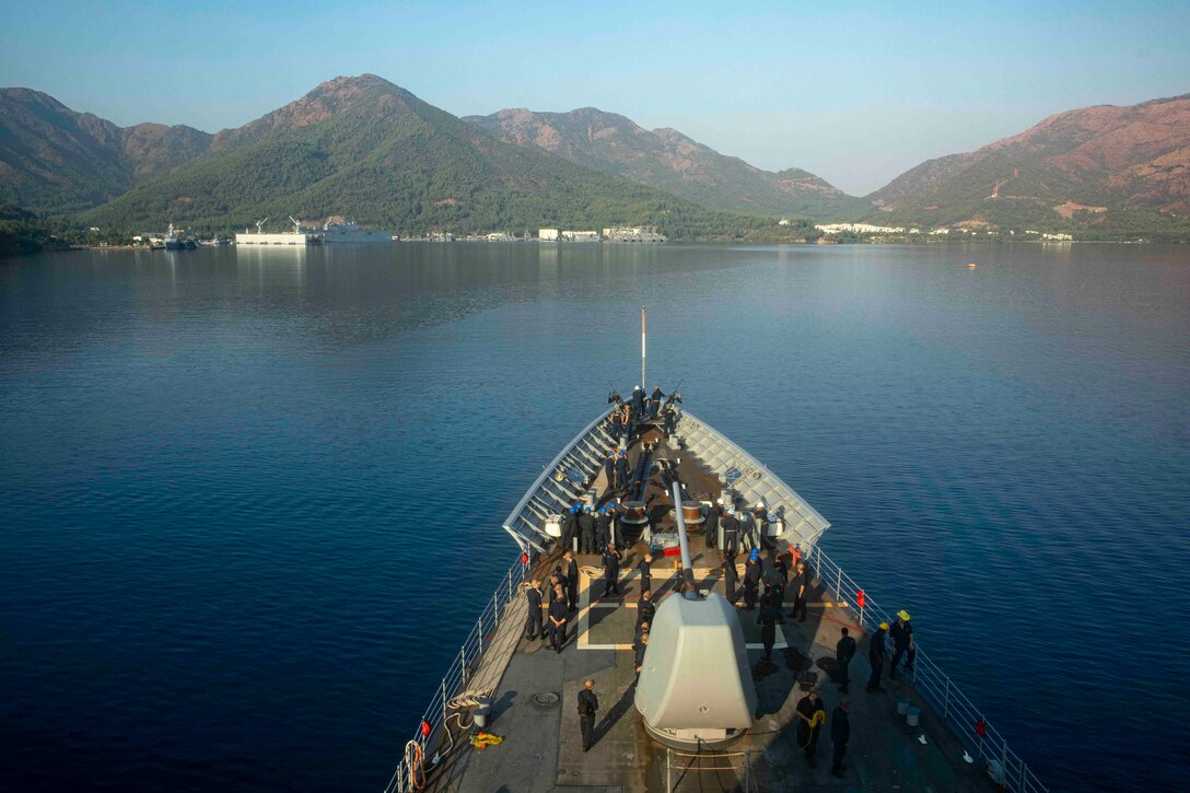 A ship sails into port.