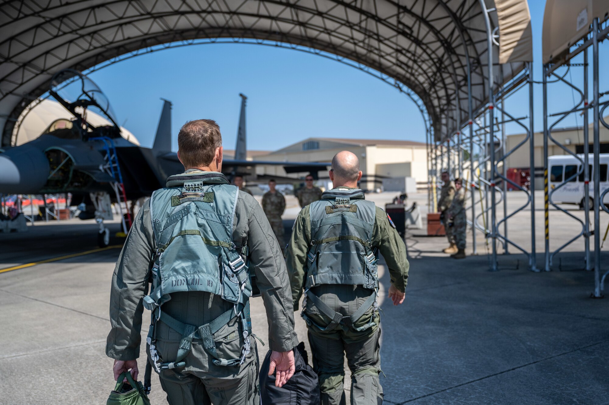 Ted Budd, left, North Carolina senator, walks to an F-15E Strike Eagle for an incentive flight at Seymour Johnson Air Force Base, North Carolina, Aug. 18, 2023. Budd and his staff help safeguard Department of Defense employee’s interests regarding working conditions, job security and employment status. (U.S. Air Force photo by Senior Airman David Lynn)