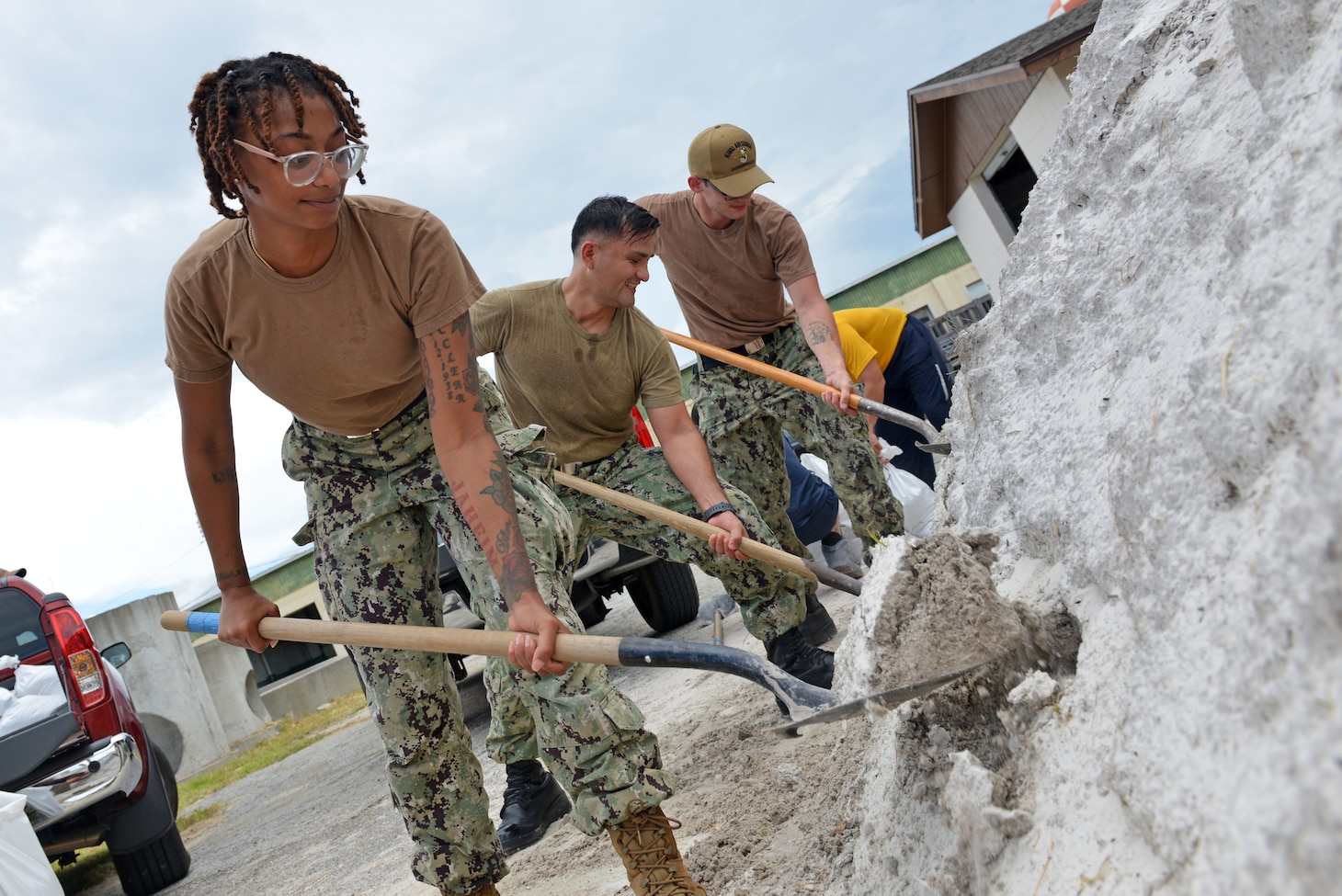JACKSONVILLE, Fla. (Aug. 28, 2023) — Machinist’s Mate 2nd Class Dasia Washington, a native of Wilmington, N.C., shovels sand into a bag aboard Naval Air Station Jacksonville in preparation for Tropical Storm, Aug. 28. Navy Region Southeast is the largest shore management region within the U.S. Navy, providing shore support for 18 installations across the southeastern United States.