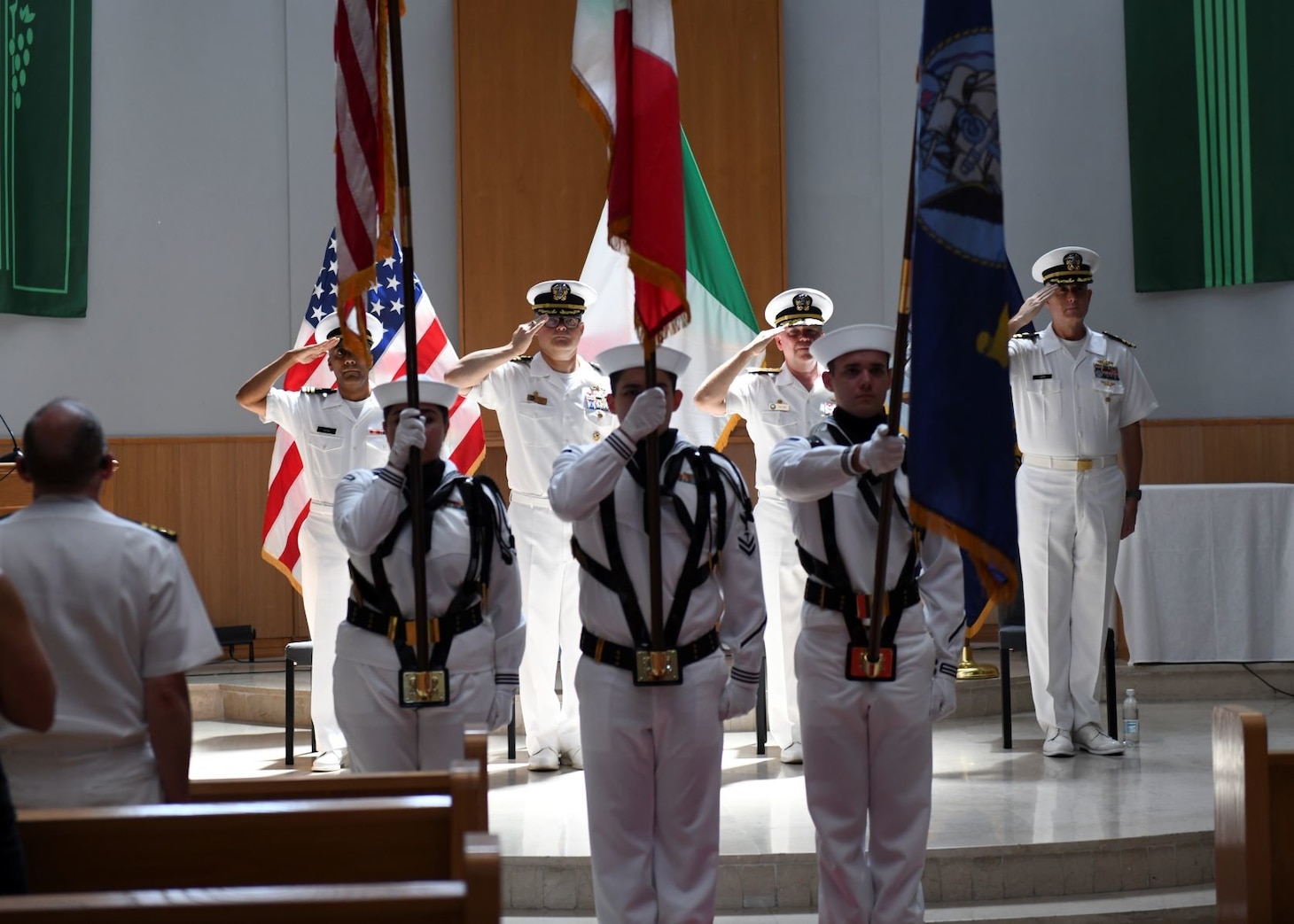 The Color Guard parades the colors during the task force (CTF) 64 change of command ceremony onboard Naval Support Activity Naples, Italy, Aug. 3, 2023. CTF 64's mission is to execute operational and tactical integrated air and missile defense (IAMD), including mission planning, execution, and operational and tactical control of assigned units for commander, U.S. Naval Forces Europe-Africa and commander, U.S. Sixth Fleet. CTF 64 also provides direct support for Aegis ballistic missile defense planning to commander, U.S. Air Forces Europe and commander, Allied Air Command. (U.S. Navy photo by Mass Communication Specialist Seaman Joseph Macklin)