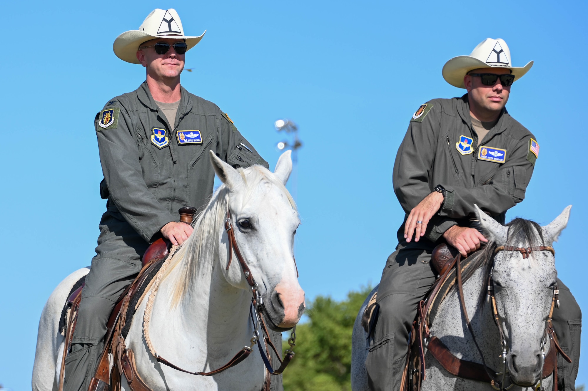 U.S. Air Force Col. Jeffrey Marshall, 97th Air Mobility Wing commander, and Chief Master Sgt. Justin Brundage, 97th Air Mobility Wing command chief, wait for the start of the 25th Annual Cattle Drive at Altus Air Force Base (AFB), Oklahoma, Aug. 24, 2023. Marshall and Brundage are the newest command team leaders at Altus AFB. (U.S. Air Force photo by Airman 1st Class Heidi Bucins)