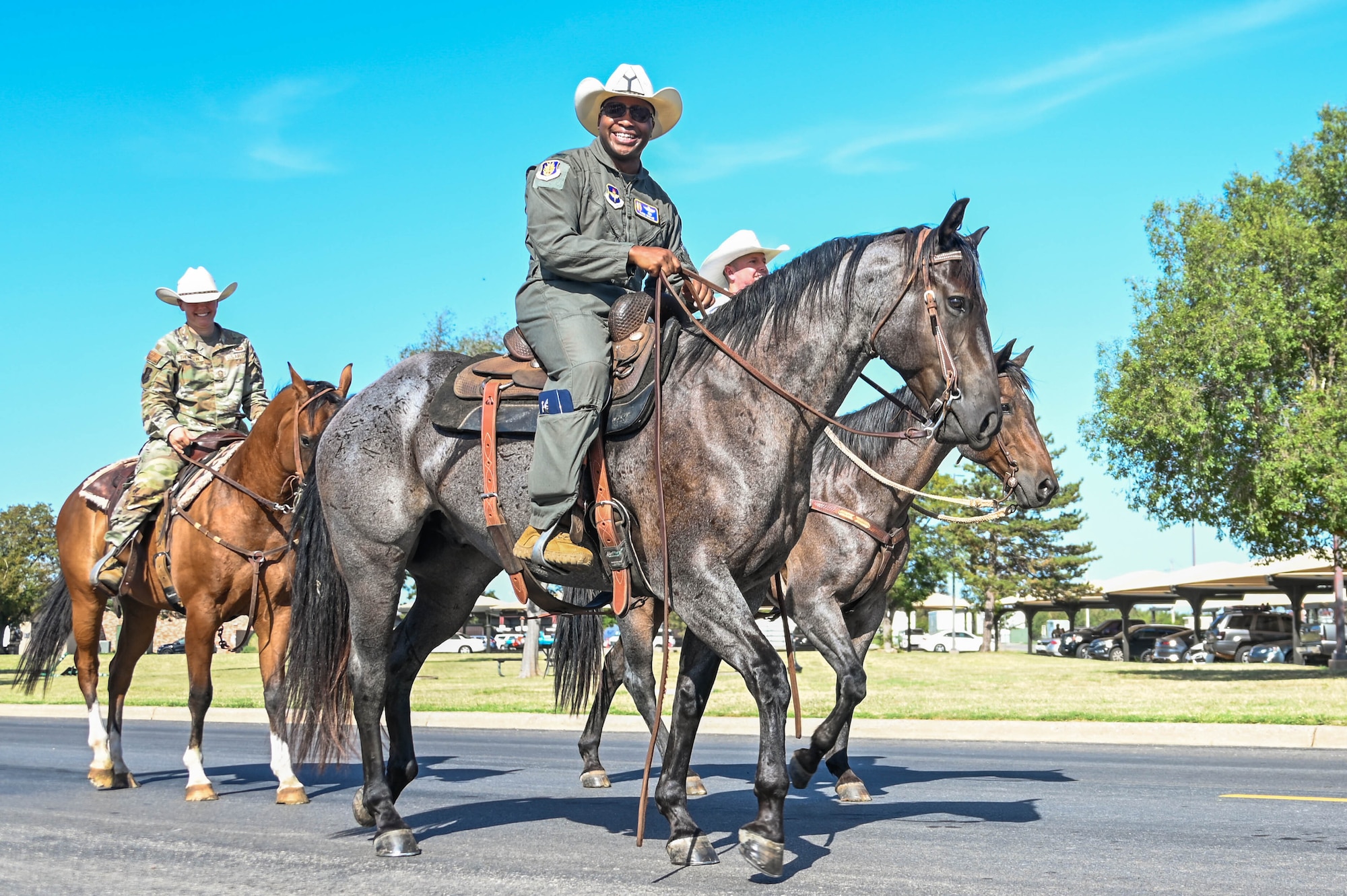U.S. Air Force Col. Patrick Brady-Lee, 97th Air Mobility Wing deputy commander, rides a horse during the 25th Annual Cattle Drive at Altus Air Force Base, Oklahoma, Aug. 24, 2023. Brady-Lee helped guide the cattle around the base as part of the annual tradition. (U.S. Air Force photo by Airman 1st Class Heidi Bucins)
