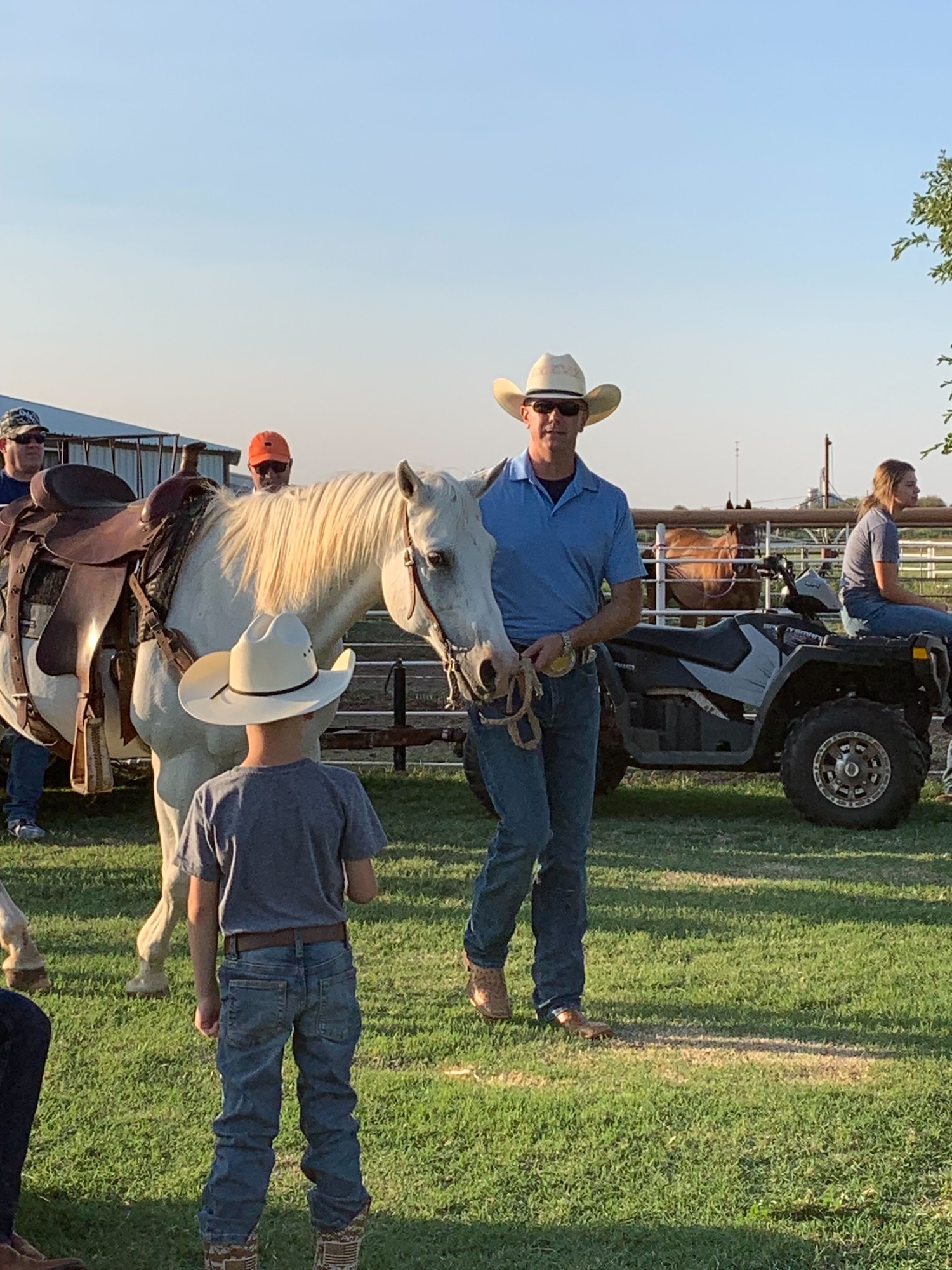 U.S. Air Force Col. Jeffrey Marshall, 97th Air Mobility Wing commander, walks a horse toward a corral during a saddle fitting for the 25th Annual Cattle Drive in Altus, Oklahoma, Aug. 19, 2023. The cattle drive is conducted in the spirit of the ‘Great Western Cattle Trail,’ which started near Kerrville, Texas, and went north all the way to Canada. (U.S. Air Force photo by Airman 1st Class Kari Degraffenreed)