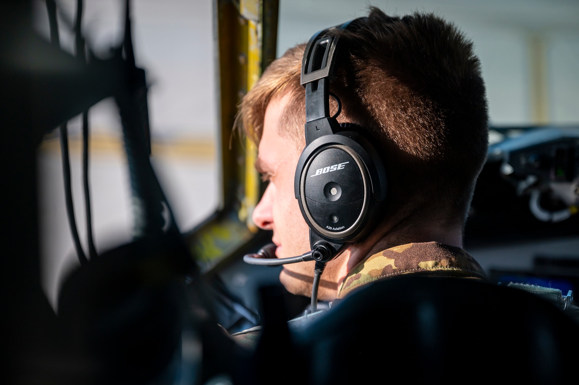 A pilot steering an aircraft