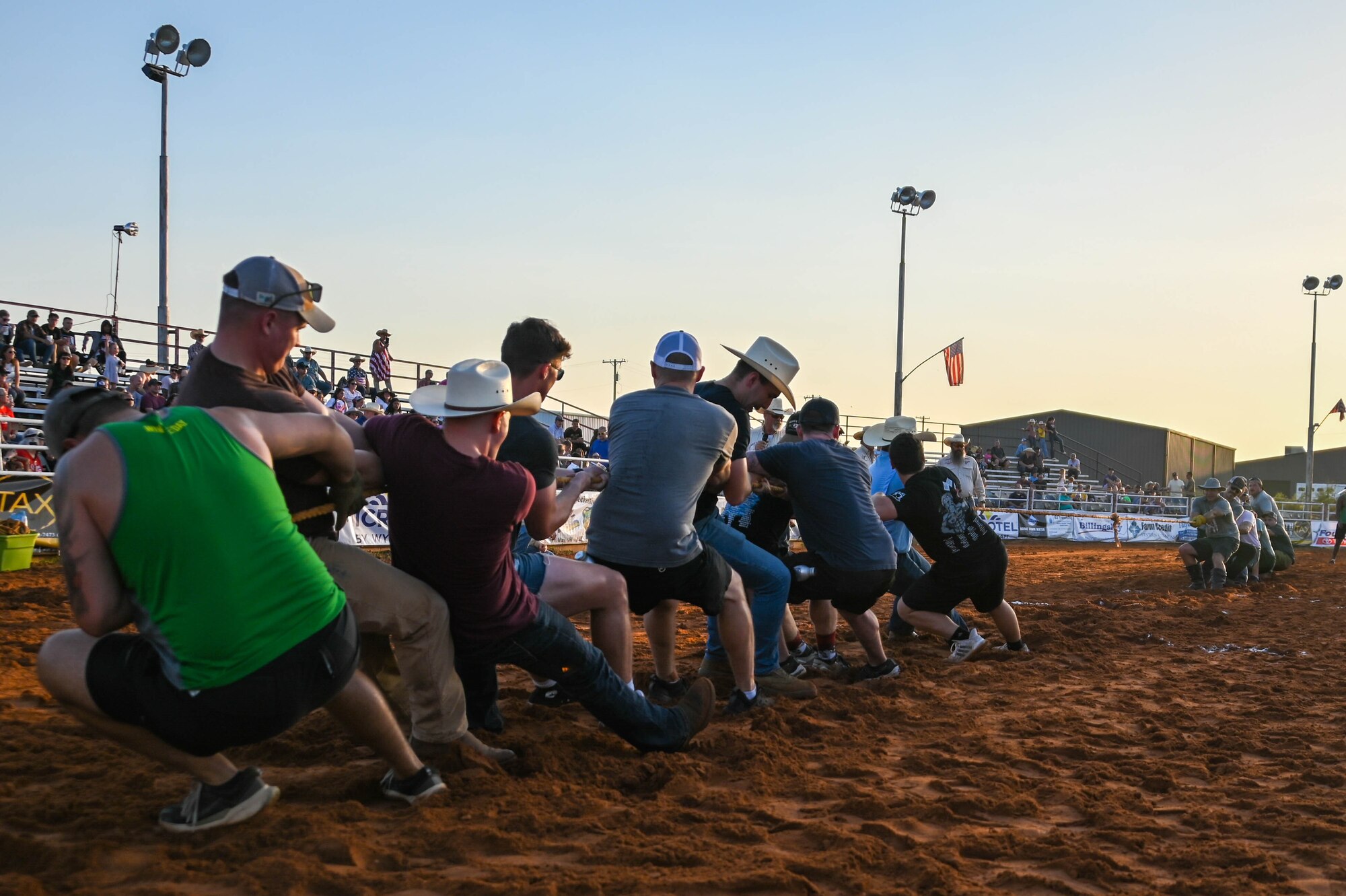 97th Air Mobility Wing Airmen participate in a tug of war competition at a Military Appreciation Night event in Altus, Oklahoma Aug. 24, 2023. Seven teams of Airmen from Altus Air Force Base took part in the event. (U.S. Air Force photo by Airman 1st Class Heidi Bucins)