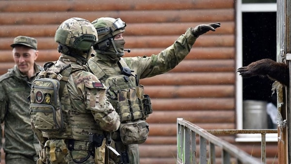 A Russian serviceman interacts with a bear at the zoo in Ukraine's port city of Mariupol on May 18, 2022, amid the ongoing Russian military action in Ukraine. AFP VIA GETTY IMAGES / OLGA MALTSEVA

Sourced from Defense One for use in "The West Should Not Wish Away the Russian Threat Yet Again" by John R. Deni https://ssi.army.afpims.mil/SSI-Media/Recent-Publications/ctl/ArticleEdit/mid/63305/Article/3508510/