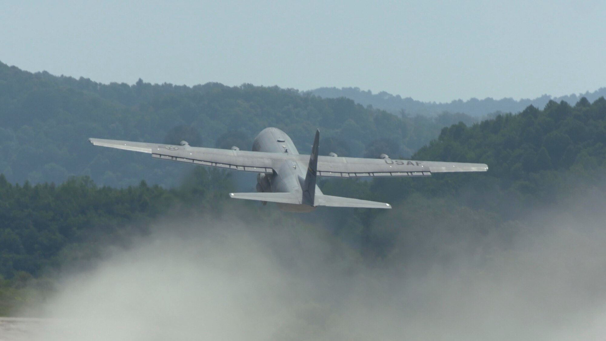 A C-130 J-30 Super Hercules aircraft assigned to McLaughlin Air National Guard Base, Charleston, West Virginia, lands at an unimproved landing zone near Logan, W. Va., August 24, 2023. Camp Branch Drop and Landing Zone is a reclaimed surface coal mine used regularly by Guard, Reserve, Active Duty, and sister service flying units across the country. (U.S. Air National Guard photo by Senior Master Sgt. Eugene Crist)