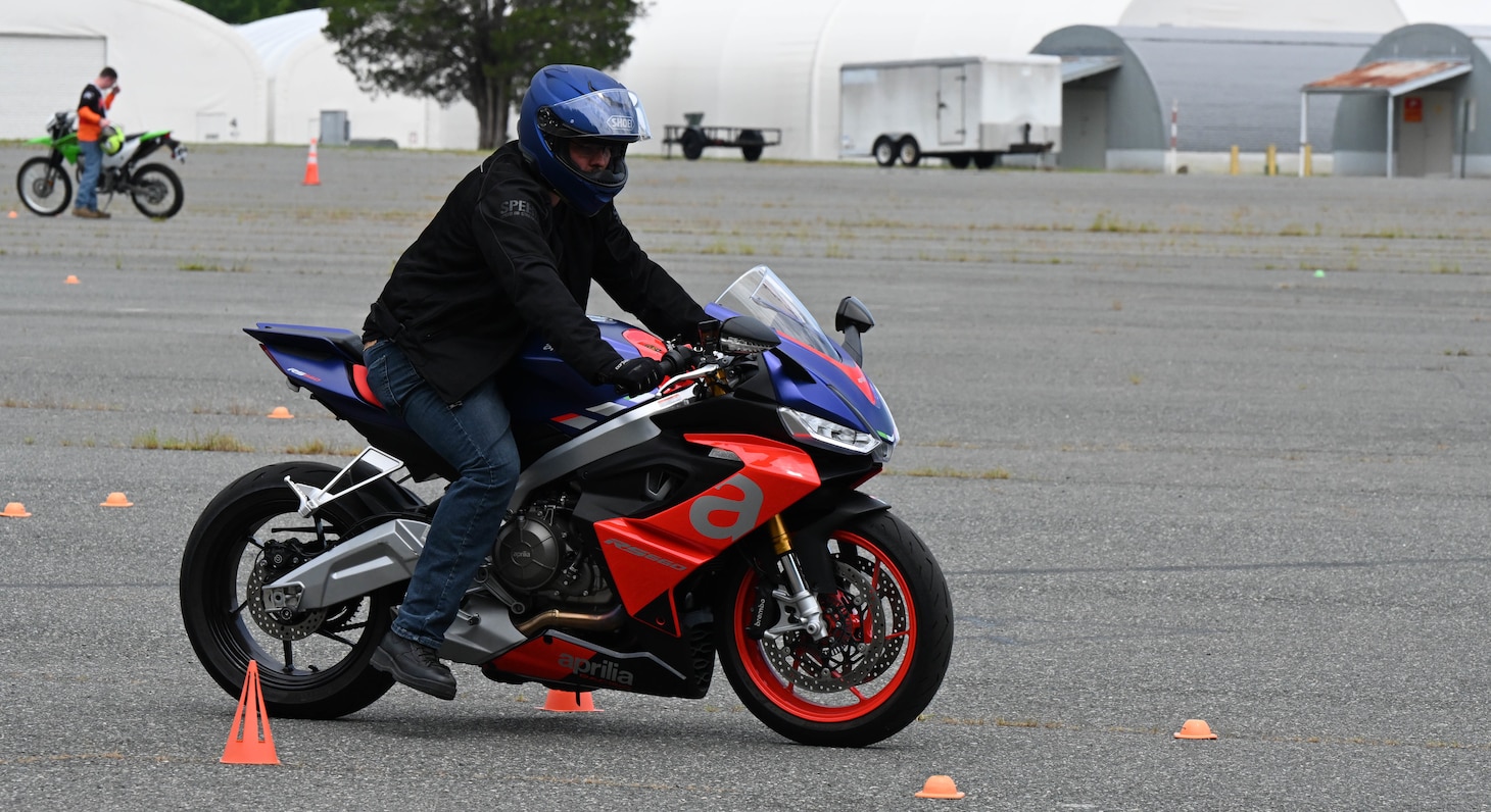 230814-N-TF169-0001 - Aviation Structural Mechanic 1st Class Matthew Sharp, an instructor at the Center for Naval Aviation Technical Training Unit Oceana on Naval Air Station Oceana, Virginia, participates in a motorcycle exercise during the Department of Defense Motorcycle Mentorship Program beta test on Marine Corps Base Quantico, Virginia, Aug. 14. The test, which took place Aug. 14-18, brought riders together from the Navy, Marine Corps, Air Force and Army to test a mentorship program conducted by the Motorcycle Safety Foundation. (U.S. Navy photo by Amy Robinson)